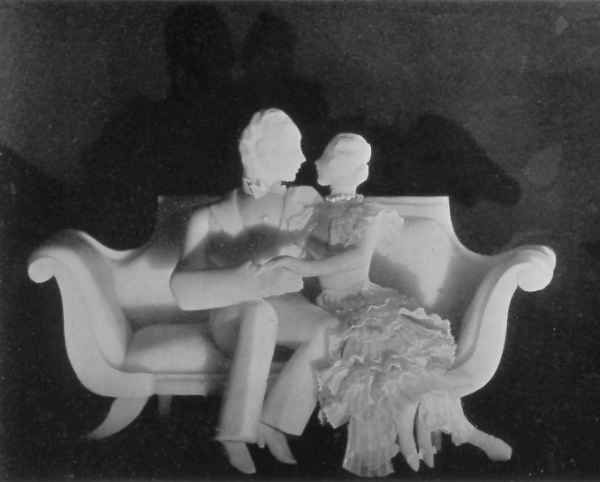 Soap sculpture of a man and woman on a divan